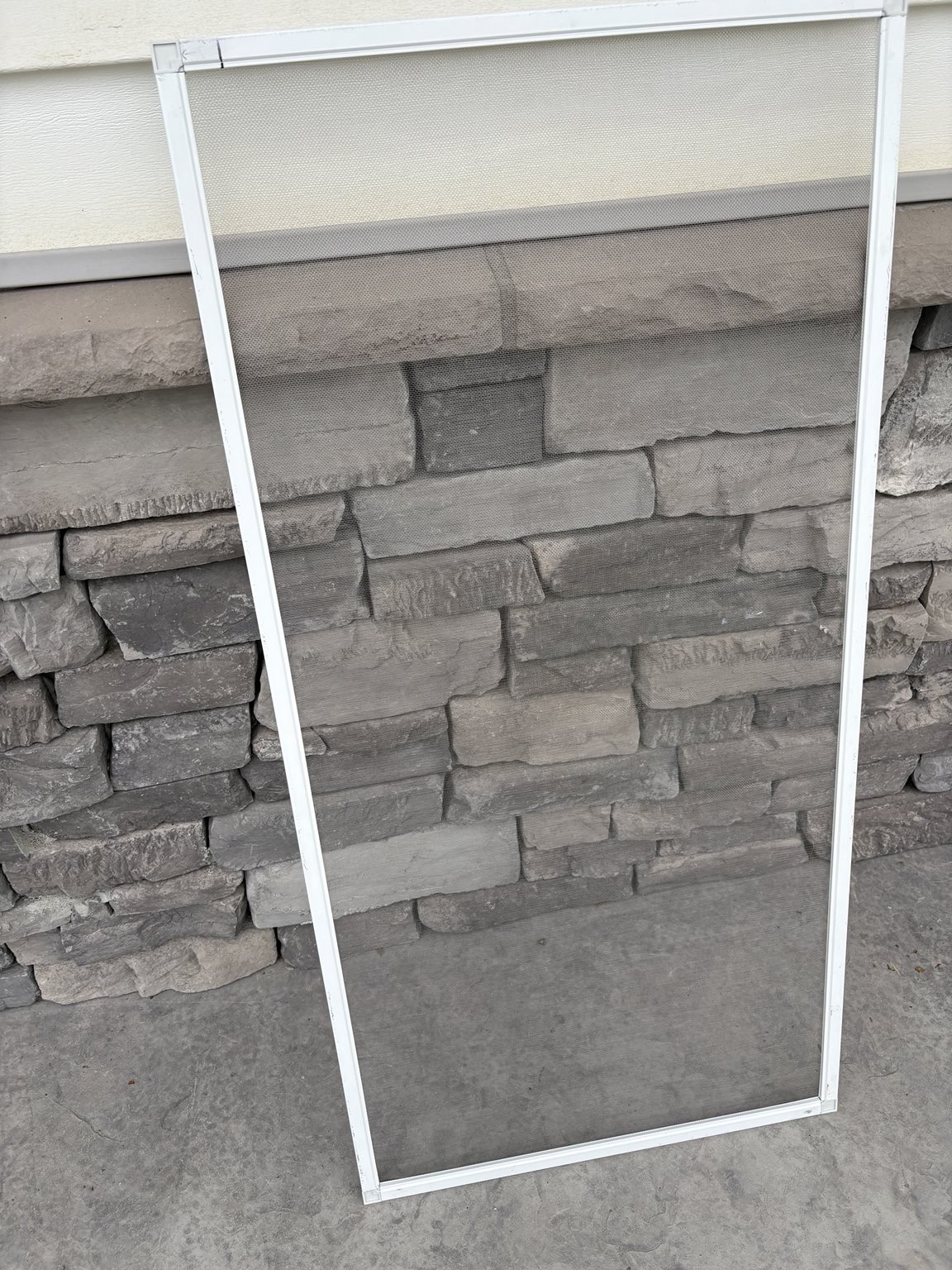 ClearView screen leaning against a stone exterior