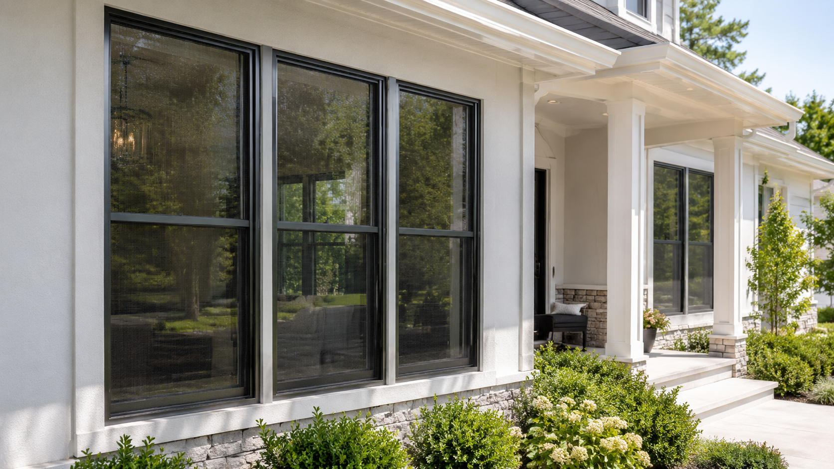 Installed window screens on a clean home exterior